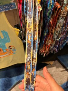 A photograph of a lanyard featuring various cartoon big cats.